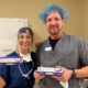 Dr. Christine Funke and Dr. Brett Clark holding Clareon® PanOptix® Pro IOL boxes in the operating suite